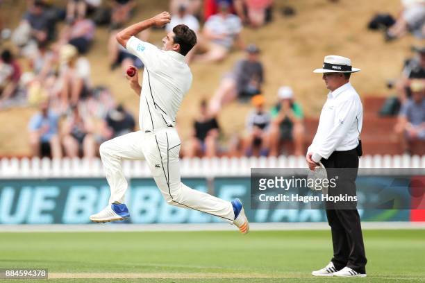 Colin de Grandhomme of New Zealand bowls while umpire Ian Gould of England looks on during day three of the Test match series between New Zealand...