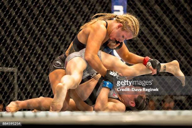 Angela Magana and Amanda Copper battle in the Octagon during a UFC bout at Little Caesars Arena on December 2, 2017 in Detroit, Michigan. Copper...