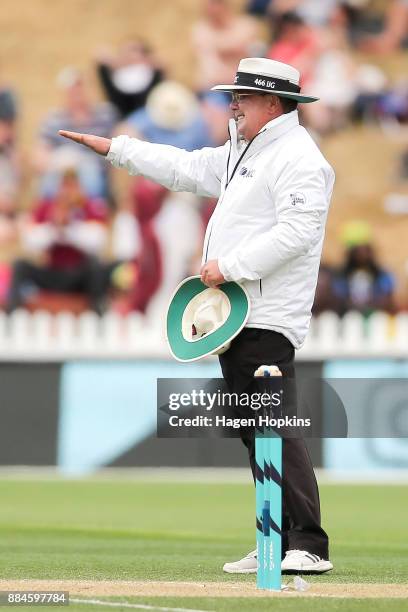 Umpire Ian Gould of England signals a boundary during day three of the Test match series between New Zealand Blackcaps and the West Indies at Basin...