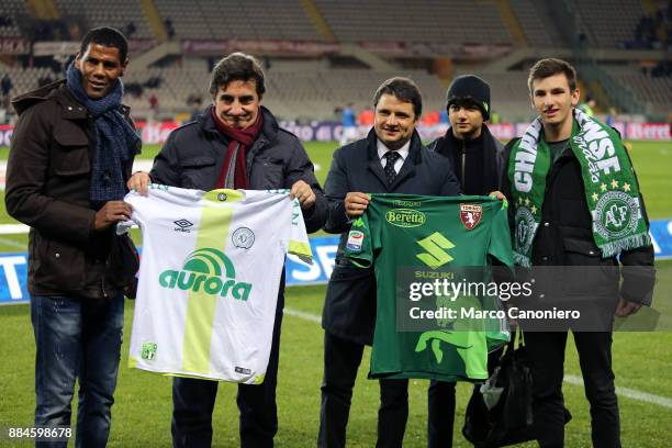 Aldair and chairman of Torino FC Urbano Cairo show the shirt in honor of the tragedy of the Chapecoense team during match between Torino FC and...