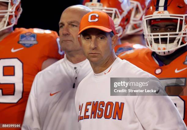 Head coach Dabo Swinney of the Clemson Tigers looks on against the Miami Hurricanes in the first quarter during the ACC Football Championship at Bank...