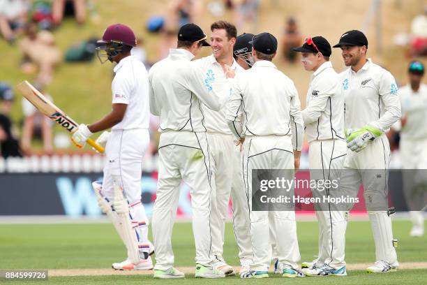 Matt Henry of New Zealand celebrates with teammates after taking the wicket of Kieran Powell of the West Indies during day three of the Test match...