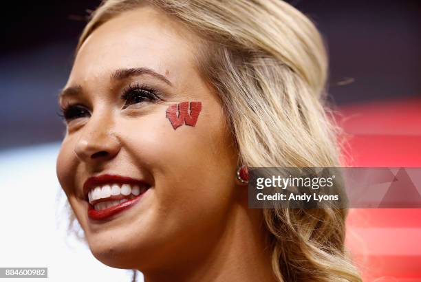 Wisconsin Badgers cheerleader performs during the first quarter against the Ohio State Buckeyes during the Big Ten Championship game at Lucas Oil...