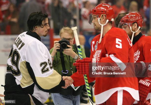 Goaltender Marc-Andre Fleury of the Pittsburgh Penguins shakes hands with Nicklas Lidstrom of the Detroit Red Wings after a 2-1 win during Game Seven...