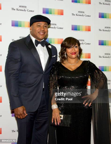 Cool J and his wife, Simone Smith, arrive for the formal Artist's Dinner honoring the recipients of the 40th Annual Kennedy Center Honors hosted by...