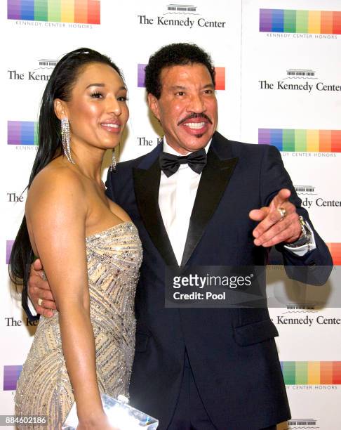 Lionel Richie and girlfriend Lisa Parigi arrive for the formal Artist's Dinner honoring the recipients of the 40th Annual Kennedy Center Honors...