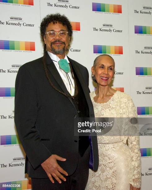 Carmen de LaVallade and her son, Leo Holder, arrive for the formal Artist's Dinner honoring the recipients of the 40th Annual Kennedy Center Honors...