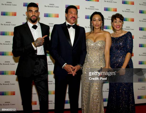 Lionel Richie, second left, arrives with son Miles, left, and girlfriend Lisa Parigi, second right, and sister Deborah Richie, right, for the formal...