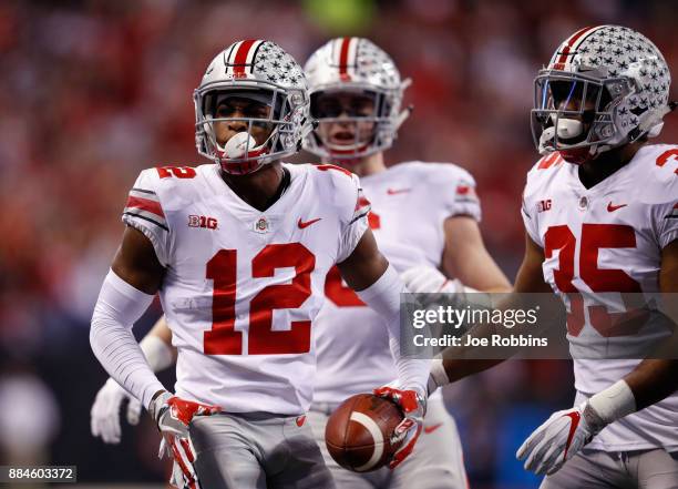 Denzel Ward of the Ohio State Buckeyes celebrates an interception against the Ohio State Buckeyes in the first half during the Big Ten Championship...