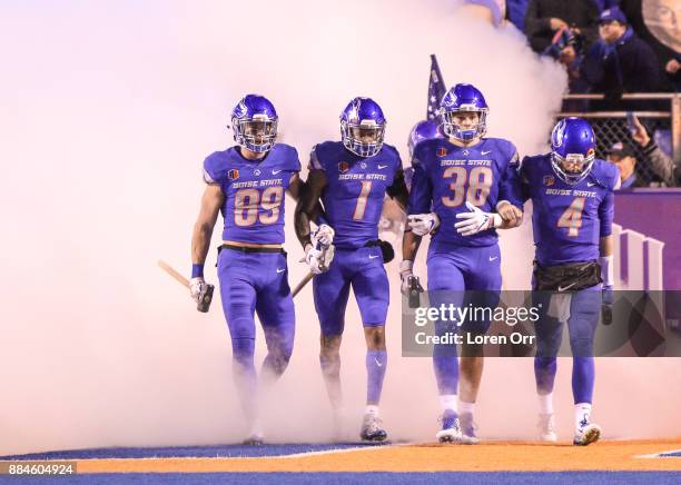 Wide receiver Brock Barr, wide receiver Cedrick Wilson, linebacker Leighton Vander Esch and quarterback Brett Rypien of the Boise State Broncos lead...