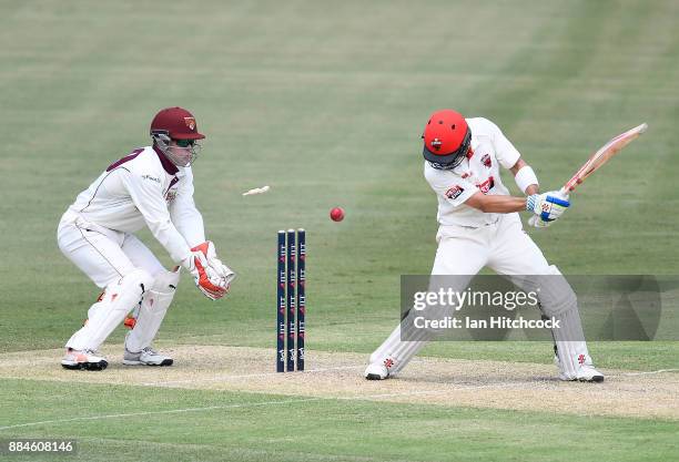 Callum Ferguson of the Redbacks is bowled out during day one of the Sheffield Shield match between Queensland and South Australia at Cazaly's Stadium...