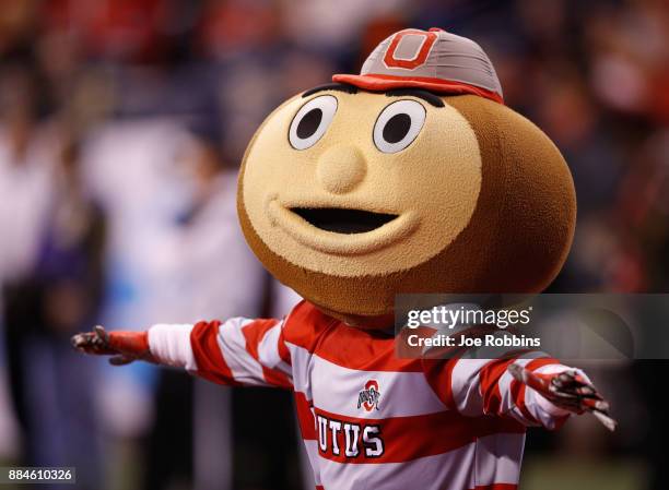 Brutus Buckeye, the mascot for the Ohio State Buckeyes, performs in the first half against the Wisconsin Badgers during the Big Ten Championship game...