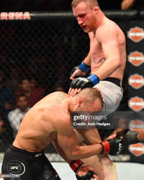 Justin Gaethje lands a flying knee against Eddie Alvarez in their lightweight bout during the UFC 218 event inside Little Caesars Arena on December...