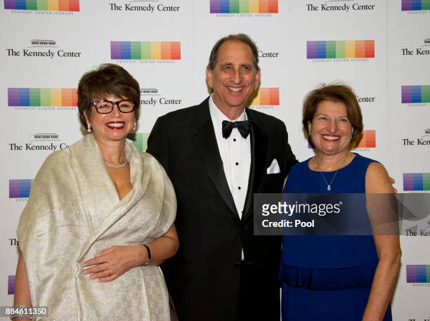 Valerie Jarrett, Neil Cohen, and Susan Sher arrive for the formal Artist's Dinner honoring the recipients of the 40th Annual Kennedy Center Honors...
