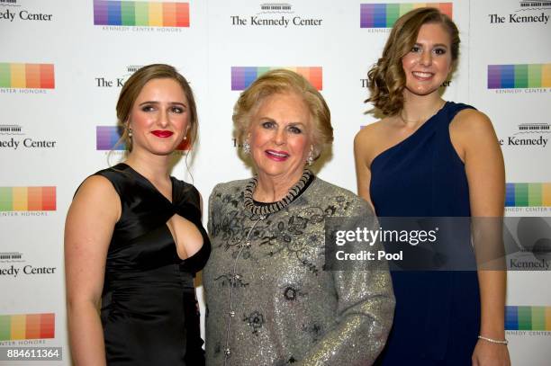 Jacqueline Mars, center, and her granddaughters, Graysen Airth, left, and Katherine Burgstahler, right, arrive for the formal Artist's Dinner...