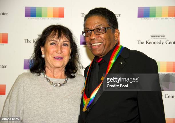 Herbie Hancock and his wife, Gigi Hancock, arrive for the formal Artist's Dinner honoring the recipients of the 40th Annual Kennedy Center Honors...