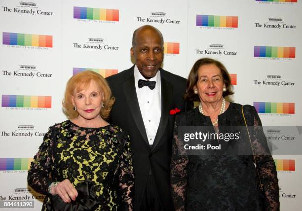 Buffy Cafritz, left, Vernon Jordan, center, and Ann Jordan arrive for the formal Artist's Dinner honoring the recipients of the 40th Annual Kennedy...