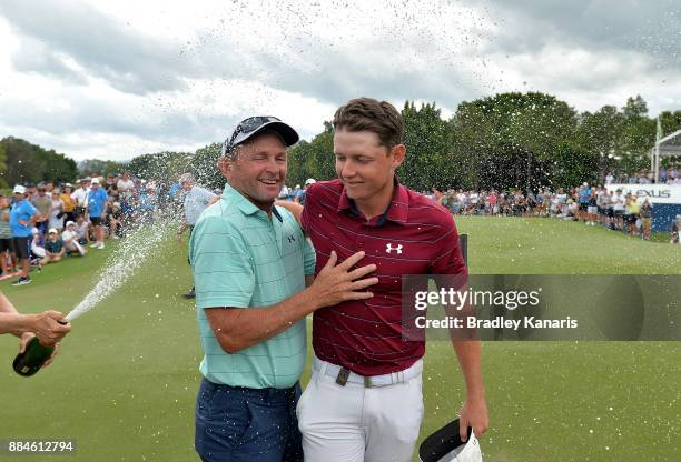 Cameron Smith of Australia celebrates victory with his father Des during day four of the 2017 Australian PGA Championship at Royal Pines Resort on...