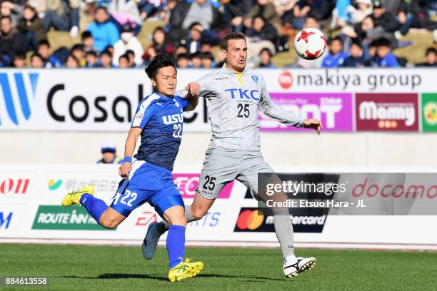 Nejc Pecnik of Tochigi SC and Masayuki Tokutake of Azul Claro Numazu compete for the ball during the J.League J3 match between Azul Claro Numazu and...