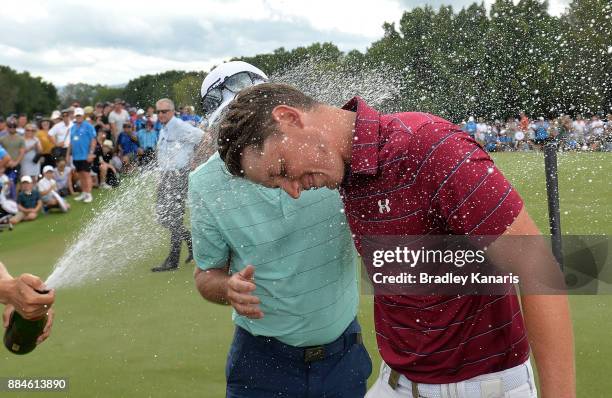 Cameron Smith of Australia is sprayed with champagne as he celebrates victory with his father Des during day four of the 2017 Australian PGA...