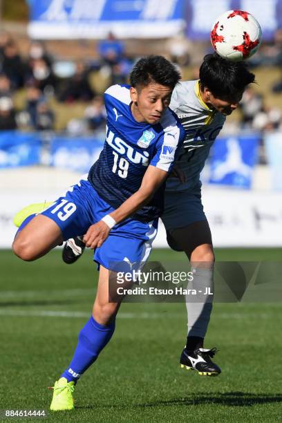 Takuma Sonoda of Azul Claro Numazu and Kenya Okazaki of Tochigi SC compete for the ball during the J.League J3 match between Azul Claro Numazu and...
