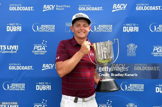 Cameron Smith of Australia celebrates victory as he holds up the Kirkwood Cup during day four of the 2017 Australian PGA Championship at Royal Pines...