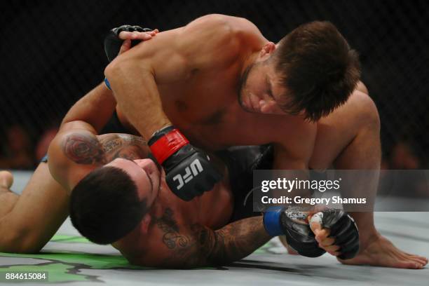 Henry Cejudo battles Sergio Pettis during UFC 218 at Little Ceasars Arena on December 2, 2018 in Detroit, Michigan.