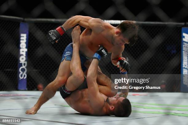 Henry Cejudo battles Sergio Pettis during UFC 218 at Little Ceasars Arena on December 2, 2018 in Detroit, Michigan.