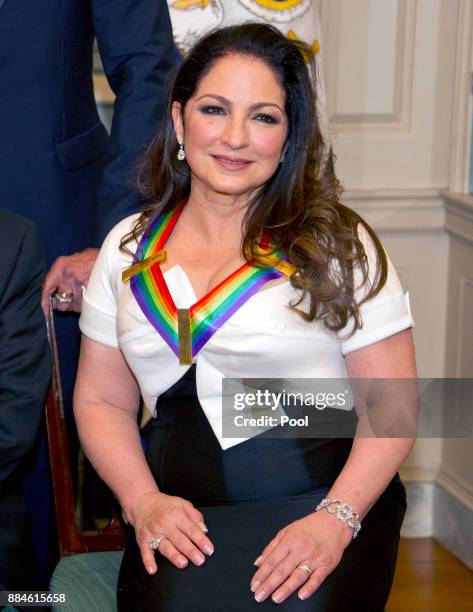 Gloria Estefan, one of he five recipients of the 40th Annual Kennedy Center Honors with her award as she poses for a group photo following a dinner...