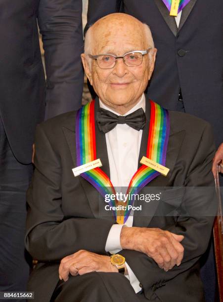 Norman Lear, one of he five recipients of the 40th Annual Kennedy Center Honors with his award as he poses for a group photo following a dinner...