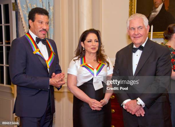 Lionel Richie, left, and Gloria Estefan, center, two of the five recipients of the 40th Annual Kennedy Center Honors speak with United States...