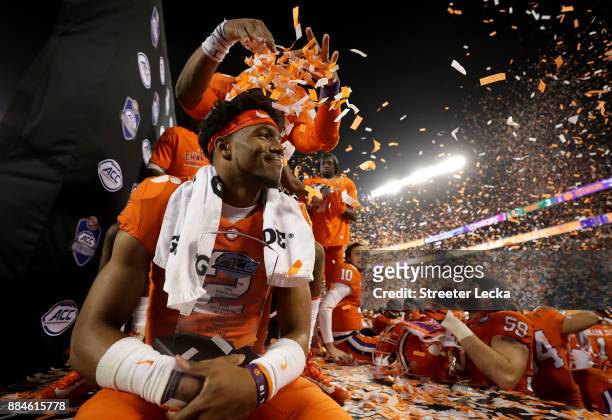 Kelly Bryant of the Clemson Tigers celebrates with the MVP trophy after defeating the Miami Hurricanes 38-3 in the ACC Football Championship at Bank...