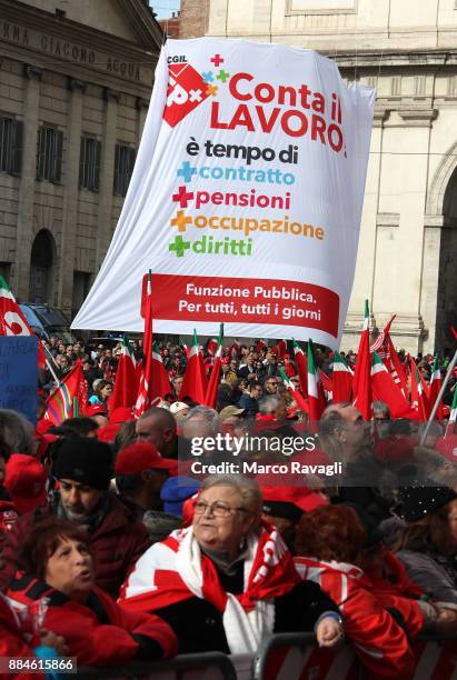People take part in a demonstration called by the General Confederation of Labor to protest against the government in defense of pensions on December...