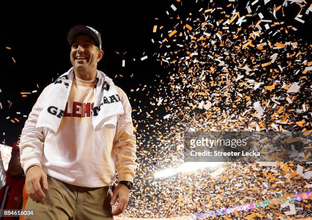Head coach Dabo Swinney of the Clemson Tigers celebrates after defeating the Miami Hurricanes 38-3 in the ACC Football Championship at Bank of...
