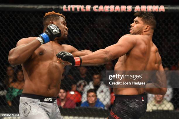 Francis Ngannou of Cameroon punches Alistair Overeem of The Netherlands in their heavyweight bout during the UFC 218 event inside Little Caesars...