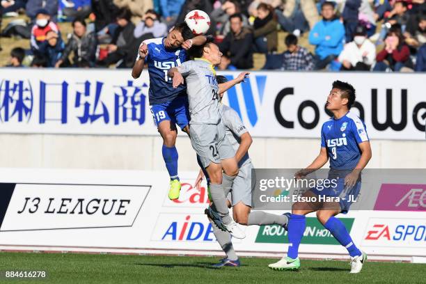 Takuma Sonoda of Azul Claro Numazu and Tatsuya Wada of Tochigi SC compete for the ball during the J.League J3 match between Azul Claro Numazu and...