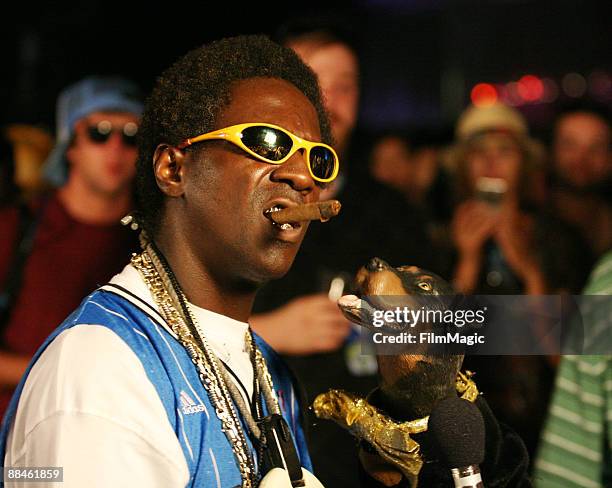 Triumph the Insult Comic Dog interviews Flavor Flav during Bonnaroo 2009 on June 12, 2009 in Manchester, Tennessee.