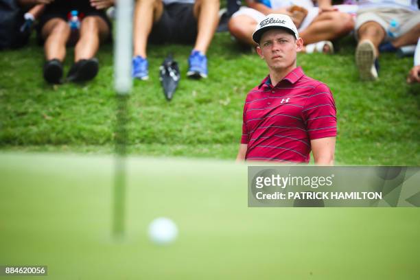 Golfer Cameron Smith of Australia watches his ball as he chips onto the green during the final round of the Australian PGA Championship golf...