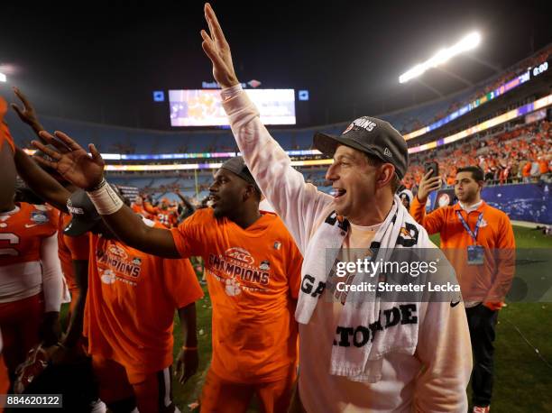 Head coach Dabo Swinney of the Clemson Tigers celebrates after defeating the Miami Hurricanes 38-3 in the ACC Football Championship at Bank of...