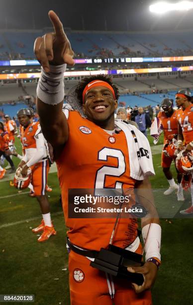 Kelly Bryant of the Clemson Tigers celebrates with the MVP trophy after defeating the Miami Hurricanes 38-3 in the ACC Football Championship at Bank...