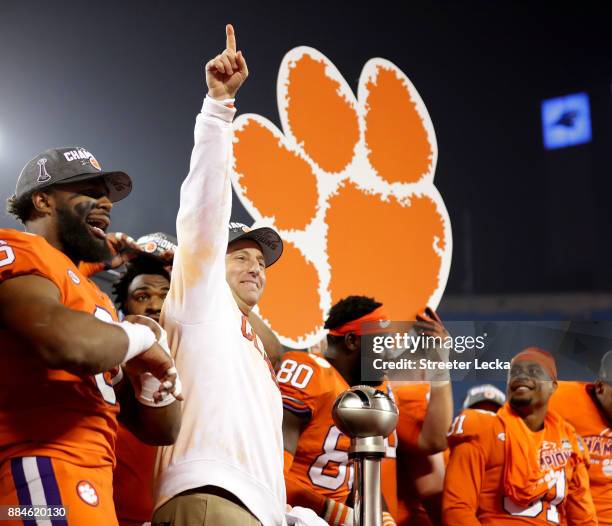 Head coach Dabo Swinney of the Clemson Tigers celebrates after defeating the Miami Hurricanes 38-3 in the ACC Football Championship at Bank of...