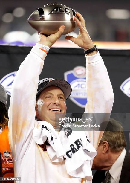 Head coach Dabo Swinney of the Clemson Tigers celebrates with the trophy after defeating the Miami Hurricanes 38-3 in the ACC Football Championship...