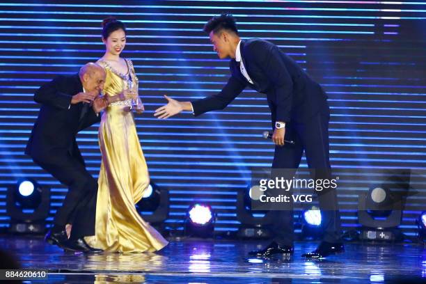President Julio Cesar Maglione shakes hands with Chinese swimmer Sun Yang during the FINA World Aquatics Gala 2017 "Soiree Des Etoiles" awards...