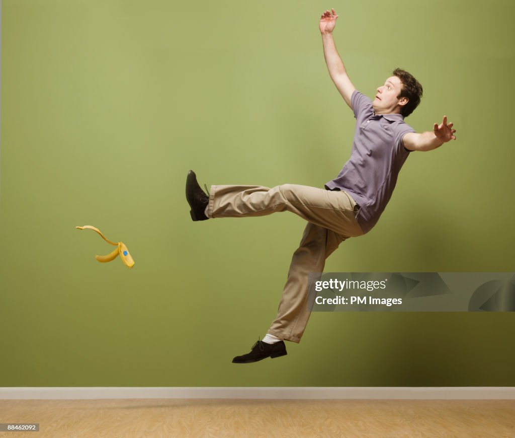 Man slipping on banana peel