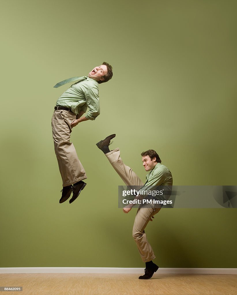 Businessman kicks himself