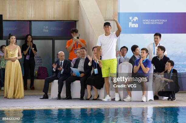 Chinese swimmer Sun Yang and British diver Tom Daley attend the FINA Open Class With The Aquatic Stars on December 2, 2017 in Sanya, Hainan Province...