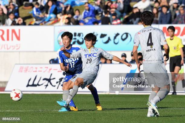 Kento Kawata of Tochigi SC and Kazuki Ota of Azul Claro Numazu compete for the ball during the J.League J3 match between Azul Claro Numazu and...