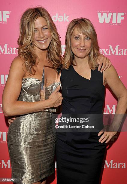 Actress Jennifer Aniston, Crystal Award honoree and Dreamworks CEO Stacey Snider pose backstage at the Women In Film 2009 Crystal + Lucy Awards at...