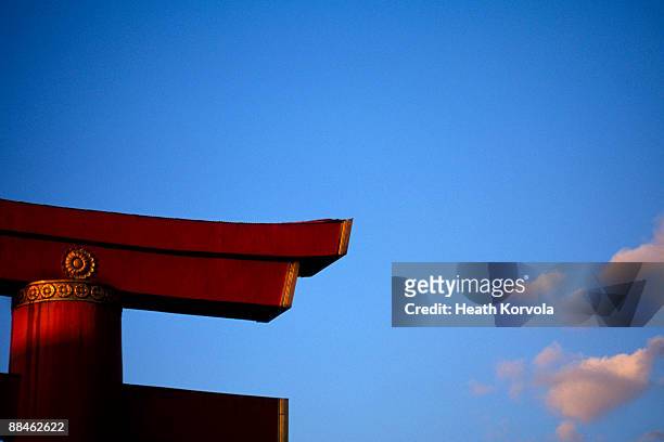 corner of large shinto gate in metro kyoto, japan. - shinto stock pictures, royalty-free photos & images