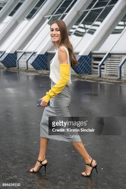 Fashion designers and Co Founder of fashion label Attico Giorgia Tordini wears a Calvin Klein top and skirt, Gianvito Rossi shoes and Loewe earrings...